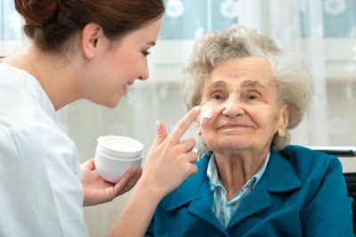 Trained caregiver providing gentle memory care support