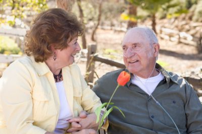 Warm family visiting and connecting in garden setting